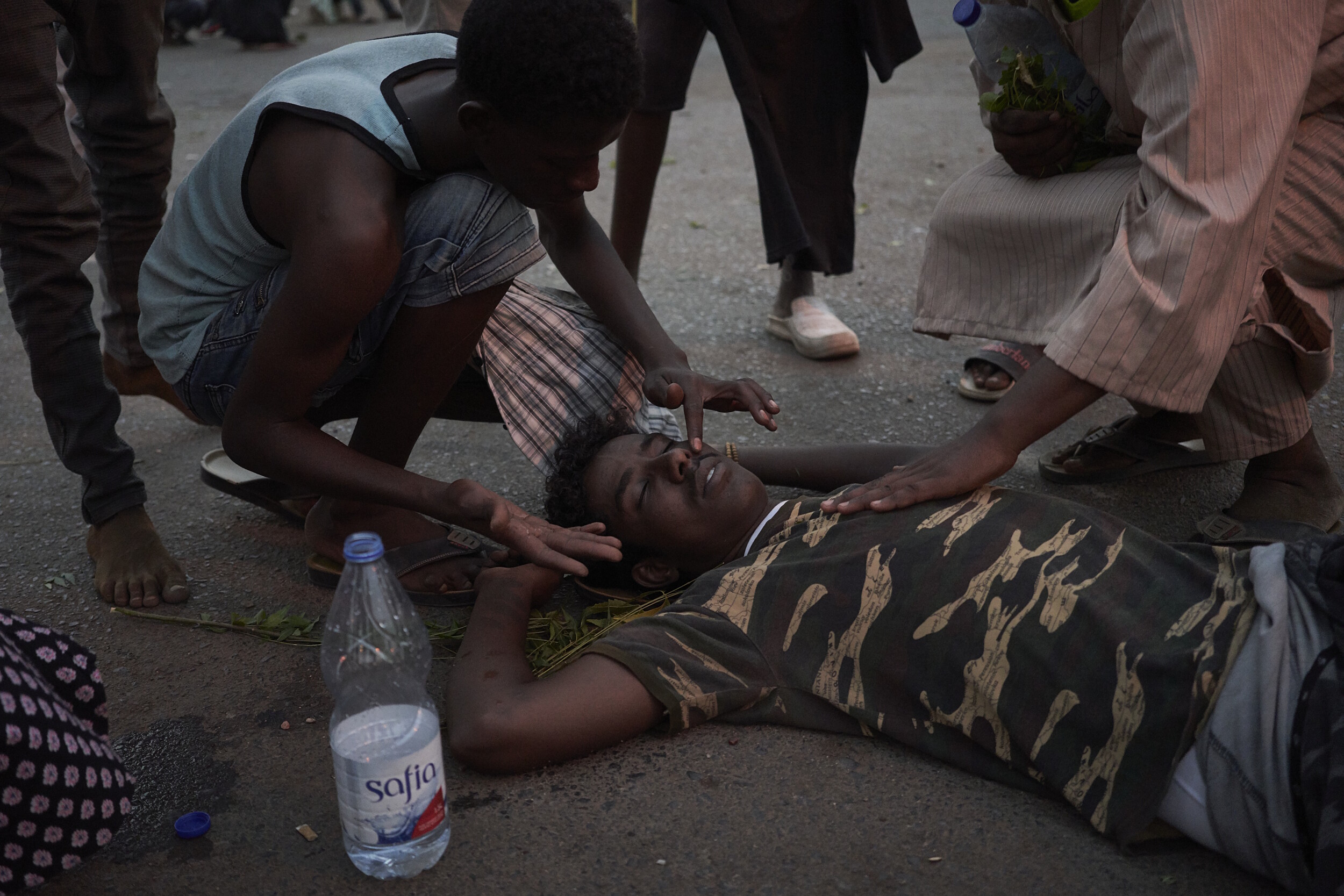 A protesters faints from tear gas