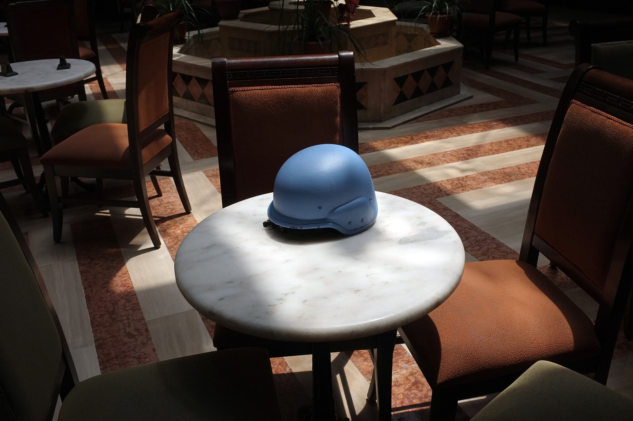 The helmet of a UN observer in a hotel in Homs.