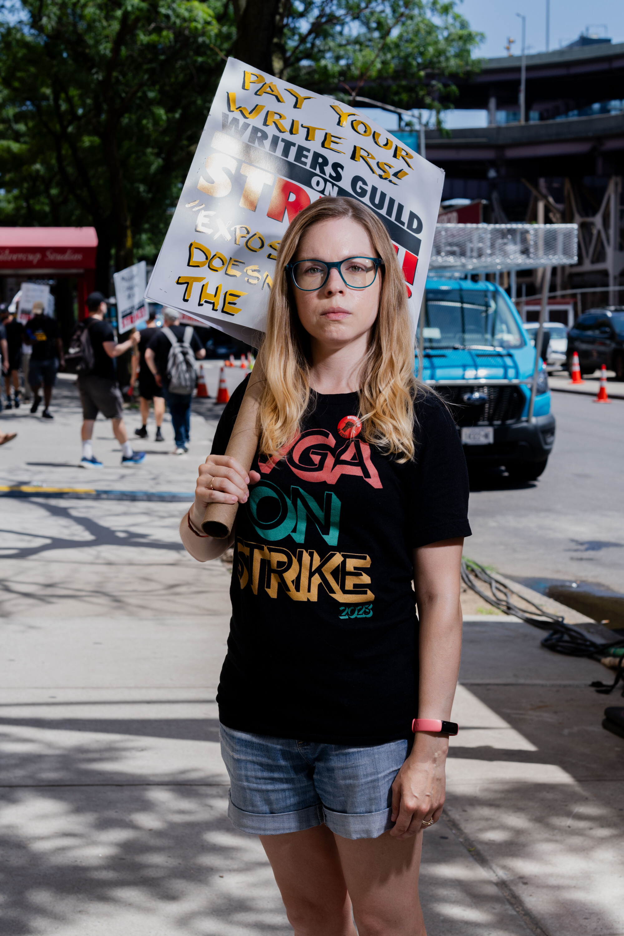 Portrait of Sasha Stewart, one of the WGA strikers in front of Silvercup Studios